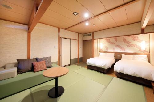 Una cama o camas en una habitación de Yukibou Hakusen