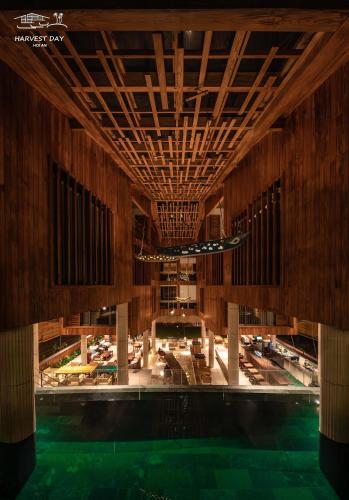 a view of a swimming pool in a building at Harvest Day Hoi An in Hoi An