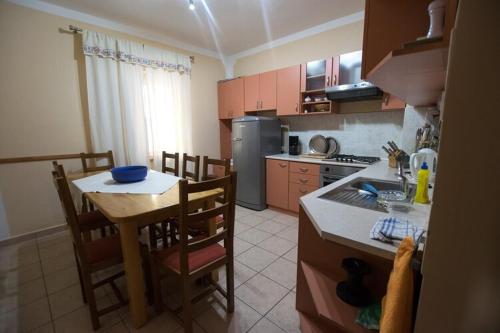 a kitchen with a table and a kitchen with a counter top at Apartment Grande Vista in Starigrad Paklenica with a large terrace in Starigrad-Paklenica