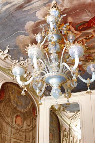 a chandelier hanging from the ceiling in a building at Palazzo Niccolini al Duomo Residenza D'Epoca in Florence