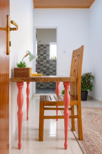 a dining room table with a chair and a desk at House of Sincerity in Maharagama