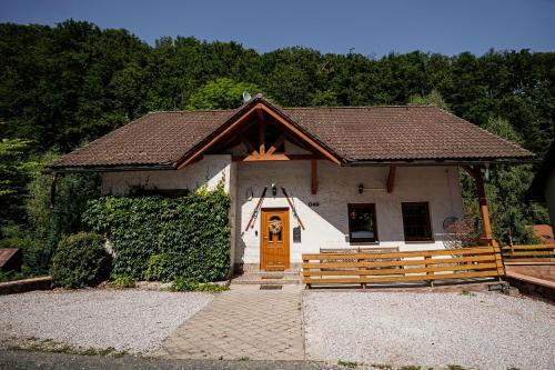 a small white chapel with a brown door at Horská chata 049 Prkenný Důl, Žacléř, Krkonoše in Žacléř
