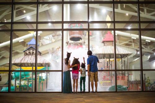 a group of people standing in front of a playground at Great Wolf Lodge Grapevine in Grapevine