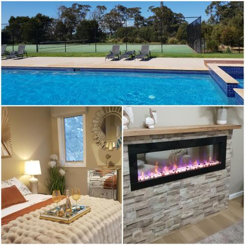 a living room with a fireplace and a swimming pool at Island Rose - Luxe Resort Villa 3 x bedroom - Phillip Island in Cowes