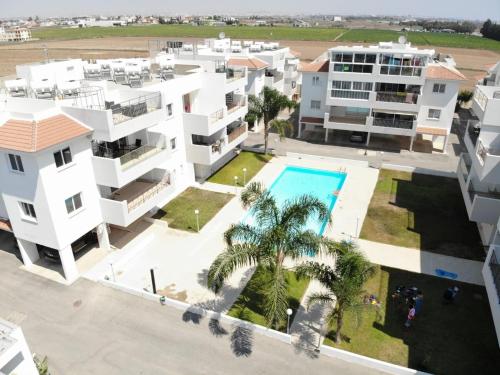 an aerial view of a apartment complex with a swimming pool at Meneou Apartment in Meneou