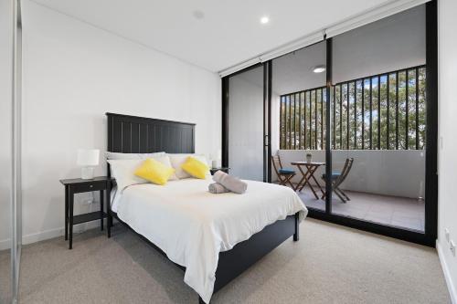 a bedroom with a large bed and a balcony at Bright & Stylish 2-Bedroom Escape in Gordon in Gordon