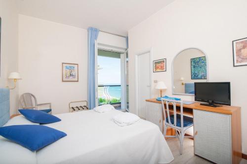 Postel nebo postele na pokoji v ubytování Hotel Majestic