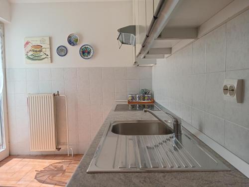 a kitchen with a sink and a counter top at Family house with swimming pool and secluded garden - by TRAVELER tourist agency - ID 2687 in Poreč