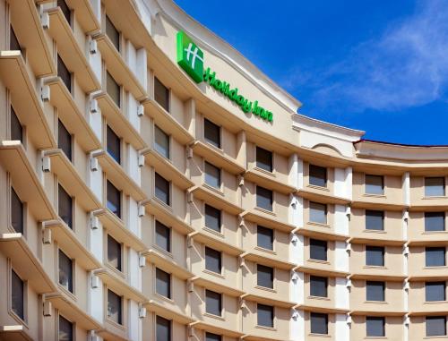 a building with a hotel sign on it at Holiday Inn Express Dallas Market Center by IHG in Dallas
