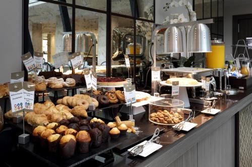 a bakery with a bunch of different types of pastries at Eurostars Casa de la Lírica in Madrid