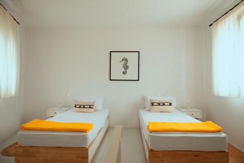 Katil atau katil-katil dalam bilik di Tinos Treasures Apart-Hotel