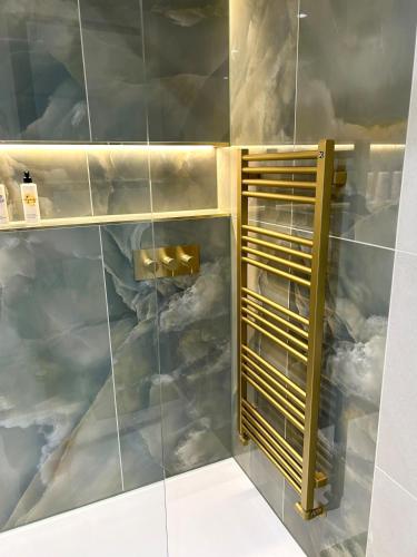a bathroom with a mural of clouds on the wall at Luxury Flat in Shaftesbury by JOT STAYS in Shaftesbury