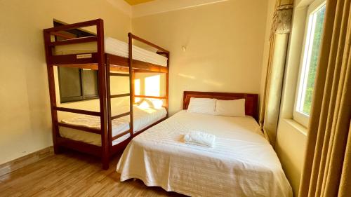 Postel nebo postele na pokoji v ubytování Hotel CÔ CÚC