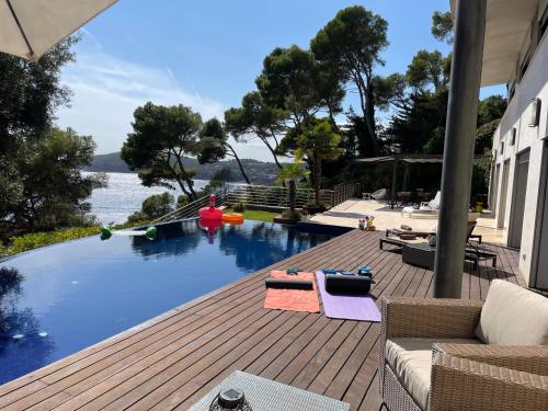 a swimming pool with a view of the water at Blueview Villa in Llafranc