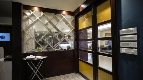 a dining room with a table and a window at KIIT Residency Patia, Bhubaneswar in Bhubaneshwar
