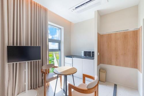 Televisyen dan/atau pusat hiburan di Algoboni Hotel