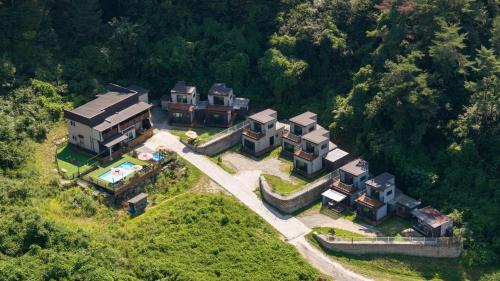 an aerial view of a house on a hill at Hongcheon stone brown Pension in Hongcheon