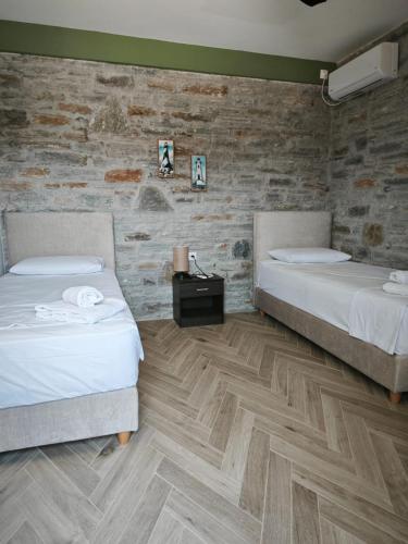 Кровать или кровати в номере Bellevia Stone Pool Villa