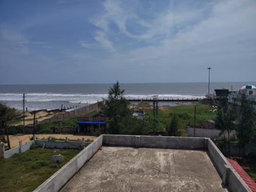 a view of the beach from the roof of a building at Sea Smile Inn in Mandarmoni