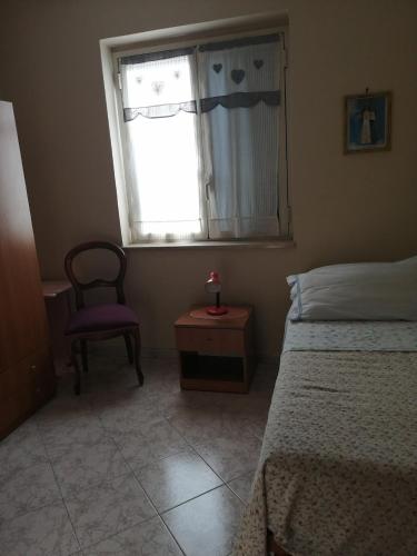 Ένα ή περισσότερα κρεβάτια σε δωμάτιο στο B&B Madama Marta