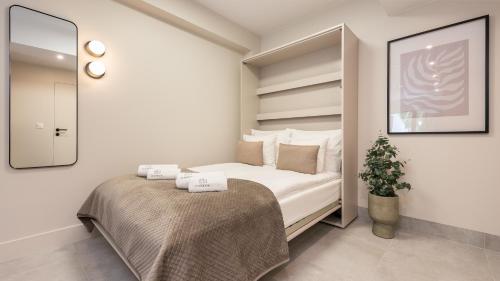 Ένα ή περισσότερα κρεβάτια σε δωμάτιο στο Flatbook Apartamenty - Krynica Morska Enklawa z basenem przy Zalewie Wiślanym