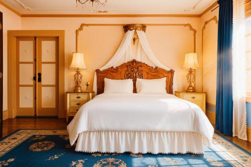 a bedroom with a large white bed with a canopy at Iconic Hollywood Homestay Near Walk Of Fame in Los Angeles