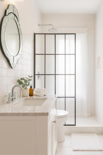a bathroom with a sink and a toilet and a mirror at Iconic Hollywood Homestay Near Walk Of Fame in Los Angeles