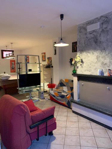 a living room with a couch and a fireplace at Tana per gli ospiti in Terni