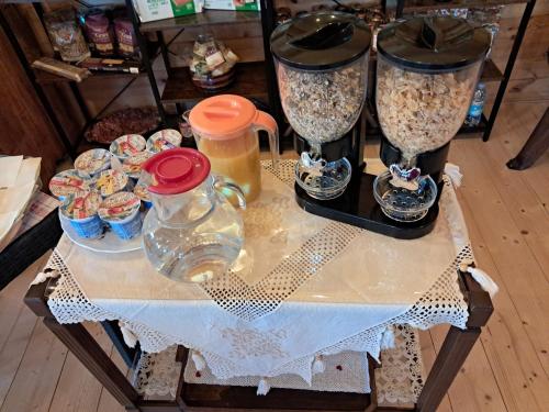 a table with some food and some drinks on it at Villaggio Turistico Tecciù di Cuppi in Magliolo