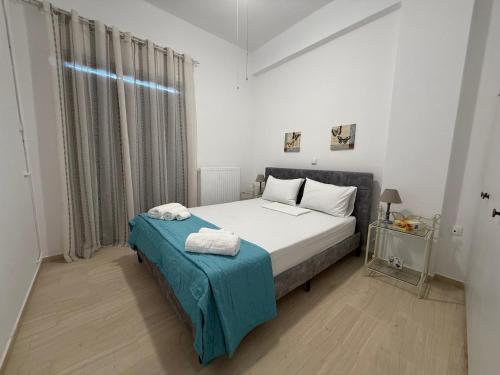 Ένα ή περισσότερα κρεβάτια σε δωμάτιο στο Villia home
