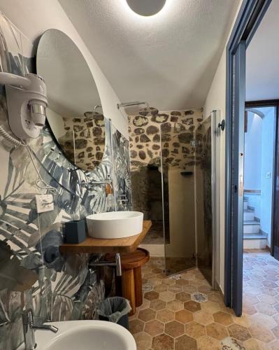 a bathroom with a sink and a mirror at piazza Immacolata 12 in Filetto