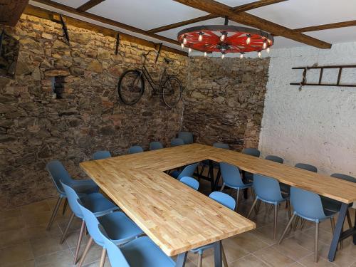 a conference room with a wooden table and chairs at Škorničkův statek in Chlum u Třeboně