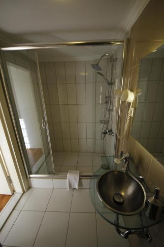 a bathroom with a sink and a shower at Taksim Home in Istanbul