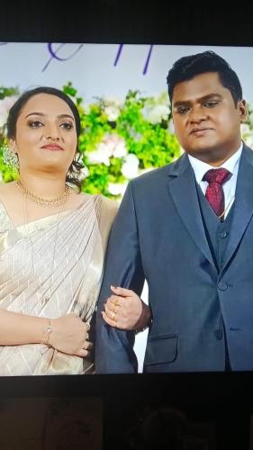 a man and a woman standing next to each other at Gilead Holliday in Tāmarakulam