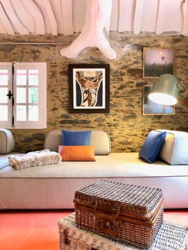 a living room with a couch and a table at The Cliffs - Cala Porto do Val in O Vicedo
