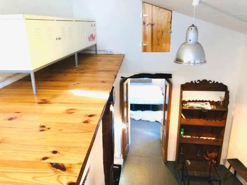 a room with a staircase with wood floors and a hallway at OBarqueiro - El descanso del Peregrino in O Barqueiro