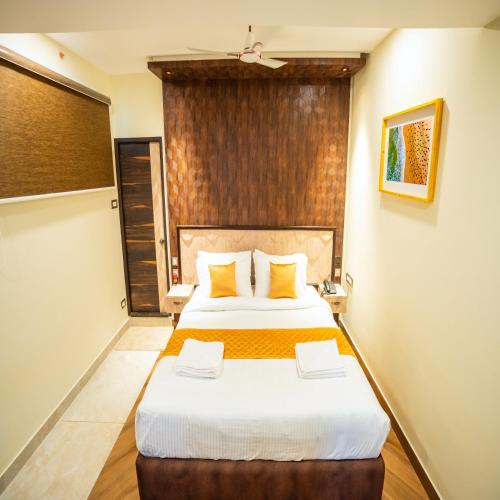 Cama o camas de una habitación en Le Majestic Business Class Hotel