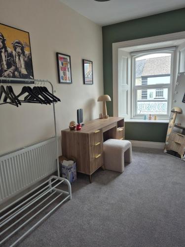 a room with a desk and a chair and a window at Entire home sleeps 8 in Cloghjordan