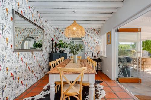 a dining room with a table and chairs at 26 on Bree in McGregor