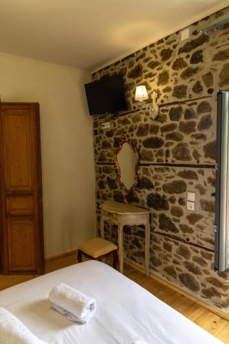 Ένα ή περισσότερα κρεβάτια σε δωμάτιο στο Kanalia Suites