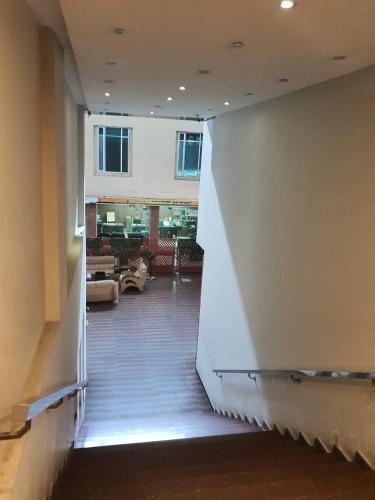 a view of a hallway in a building at Hotel The Grand Inn Complex in Lahore