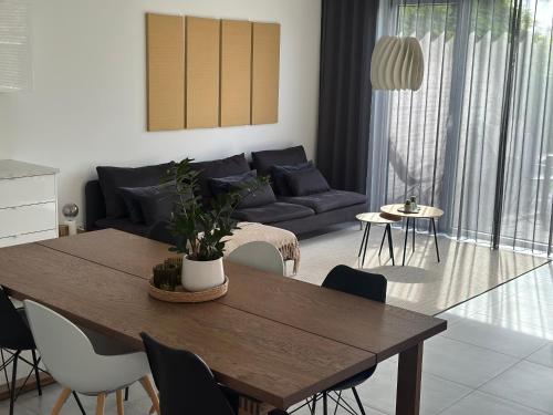 a living room with a table and a couch at Domum in Dilsen-Stokkem