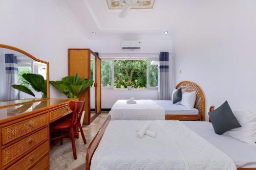 Ένα ή περισσότερα κρεβάτια σε δωμάτιο στο Villas Đồi Ngọc Tước 7PN Bãi Sau