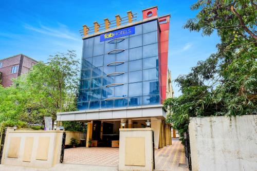 a building with a sign on top of it at FabExpress Sahil Residency in Pune