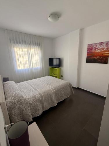 Postel nebo postele na pokoji v ubytování Apartaments La Manga Beach club