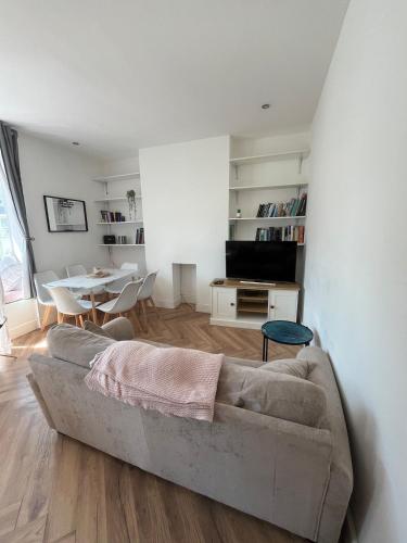 a living room with a couch and a table at Seaside 3bed 6person Apartment - Perfect Getaway Retreat in Bexhill