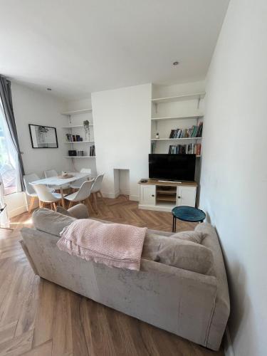 a living room with a couch and a table at Seaside 3bed 6person Apartment - Perfect Getaway Retreat in Bexhill