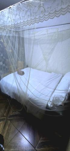 Una cama o camas en una habitación de African Tribe Hotel