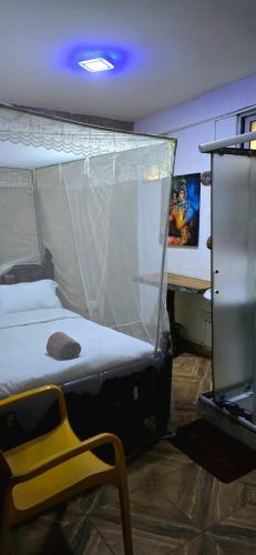 Una cama o camas en una habitación de African Tribe Hotel