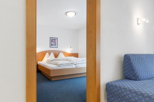 Una cama o camas en una habitación de Apart Jil-Marie